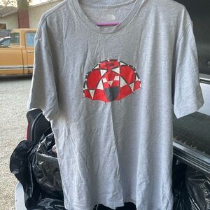 The North Face Gray Tee with Red Geometric Logo